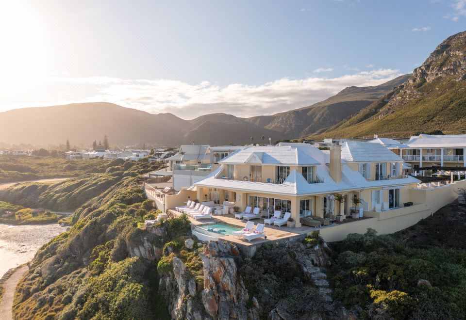 Array of white cliffside buildings overlooking the ocean at Birkenhead House, Hermanus