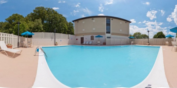 Indoor pool with lounge chairs at Holiday Inn Express Southington